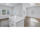 Spacious kitchen with center island, stainless appliances, and ample natural light throughout the living area at 719 19Th S St, St Petersburg, FL 33712
