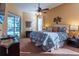 Spacious Primary bedroom with sliding doors leading to the pool area at 16303 Royal Park Ct, Tampa, FL 33647