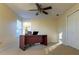 Spacious home office with a large desk and window at 16303 Royal Park Ct, Tampa, FL 33647