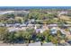 Aerial view of a single-Gathering home nestled among trees in a residential area at 4202 Las Vegas Dr, New Port Richey, FL 34653