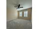 Large bedroom with ceiling fan and window shutters at 3638 Trafalgar Way # 102, Palm Harbor, FL 34685