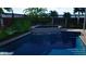 Inviting pool and spa with a waterfall feature at 511 Roanoke St, Dunedin, FL 34698
