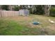 Backyard with trampoline, shed, and wooden fence at 21373 Lincoln Rd, Brooksville, FL 34601