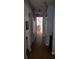 Long hallway with light wood flooring and access to bedrooms at 21373 Lincoln Rd, Brooksville, FL 34601