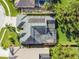 An aerial view showcasing a single-Gathering home with a pool and solar panels at 2925 Winding Trail Dr, Valrico, FL 33596