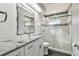 Modern bathroom with white cabinets and frameless glass shower at 2925 Winding Trail Dr, Valrico, FL 33596