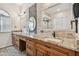 Elegant bathroom boasts double sinks, granite counters, and a large mirror at 2925 Winding Trail Dr, Valrico, FL 33596