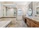 Elegant bathroom with granite countertops and large shower at 2925 Winding Trail Dr, Valrico, FL 33596