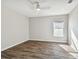 Bright bedroom featuring neutral walls and wood-look flooring at 2925 Winding Trail Dr, Valrico, FL 33596