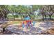 Community playground with play structures and a sandy play area at 2925 Winding Trail Dr, Valrico, FL 33596