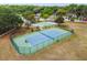 Tennis and basketball courts with surrounding fencing at 2925 Winding Trail Dr, Valrico, FL 33596