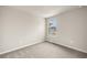 Cozy bedroom with neutral walls, carpet, and a window at 31471 Woodland Race Loop, Wesley Chapel, FL 33545