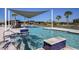 Resort-style pool with shaded seating and lounge area at 31471 Woodland Race Loop, Wesley Chapel, FL 33545