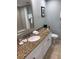 Granite countertop, sink, toilet, and bathtub at 36750 Us Highway 19 # 24212, Palm Harbor, FL 34684