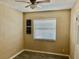 Simple bedroom with wood-look floors and ceiling fan at 4732 W Lawn Ave, Tampa, FL 33611