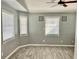 Bright bedroom with wood-look floors and window blinds at 4732 W Lawn Ave, Tampa, FL 33611