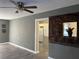 Living room with decorative wall and kitchen access at 4732 W Lawn Ave, Tampa, FL 33611