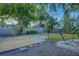 Large backyard with a wooden deck and lush landscaping at 5135 Newton S Ave, Gulfport, FL 33707