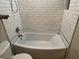 Clean bathroom featuring a bathtub with white subway tile at 5135 Newton S Ave, Gulfport, FL 33707