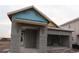 New construction home exterior with stucco siding and a two-car garage at 633 Allora Ave, Nokomis, FL 34275