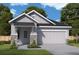 One-story home with gray siding, stone accents, and a two-car garage at 633 Allora Ave, Nokomis, FL 34275