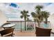 Balcony with ocean view and seating area at 7100 Sunset Way # 205, St Pete Beach, FL 33706