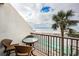 Balcony with ocean view and seating area at 7100 Sunset Way # 205, St Pete Beach, FL 33706