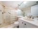 Clean bathroom with a shower and white vanity at 7100 Sunset Way # 205, St Pete Beach, FL 33706