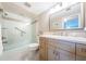 Updated bathroom with a large vanity and a tub shower at 7100 Sunset Way # 205, St Pete Beach, FL 33706