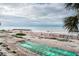 Beachfront view with shuffleboard courts at 7100 Sunset Way # 205, St Pete Beach, FL 33706