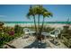 Beachfront patio furniture with ocean views at 7100 Sunset Way # 205, St Pete Beach, FL 33706