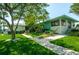 Landscaped grounds and community building at 7100 Sunset Way # 205, St Pete Beach, FL 33706