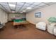 Community game room with pool table and seating at 7100 Sunset Way # 205, St Pete Beach, FL 33706