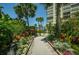 Landscaped garden path leading to community amenities at 7100 Sunset Way # 205, St Pete Beach, FL 33706