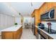 Modern kitchen with stainless steel appliances and an island at 7100 Sunset Way # 205, St Pete Beach, FL 33706