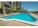 Resort-style pool with plenty of space for lounging at 7100 Sunset Way # 205, St Pete Beach, FL 33706