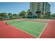 Two well-maintained tennis courts at 7100 Sunset Way # 205, St Pete Beach, FL 33706