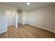 Well-lit bedroom with wood-look floors and a closet at 10334 Pendleton Ave, Englewood, FL 34224