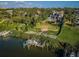 Luxury home with private dock and lush landscaping near waterway at 118 Harbor View Ln, Belleair Bluffs, FL 33770