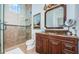 Elegant bathroom with granite vanity and glass shower at 118 Harbor View Ln, Belleair Bluffs, FL 33770