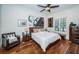 Spacious bedroom with hardwood floors and large window at 118 Harbor View Ln, Belleair Bluffs, FL 33770