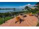 Relaxing firepit area with chairs and waterfront view at 118 Harbor View Ln, Belleair Bluffs, FL 33770