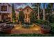 Ornate landscaping with fountain at night at 118 Harbor View Ln, Belleair Bluffs, FL 33770