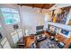 High-ceilinged living room with hardwood floors, piano, and large windows at 118 Harbor View Ln, Belleair Bluffs, FL 33770