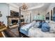 Luxurious main bedroom with fireplace and king-size bed at 118 Harbor View Ln, Belleair Bluffs, FL 33770