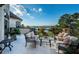 Relaxing patio with seating area and water views at 118 Harbor View Ln, Belleair Bluffs, FL 33770