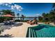 Inviting pool and patio area with water views at 118 Harbor View Ln, Belleair Bluffs, FL 33770