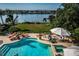 Stunning pool and spa area with water views at 118 Harbor View Ln, Belleair Bluffs, FL 33770