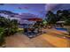 Outdoor patio furniture around a firepit near the pool at 118 Harbor View Ln, Belleair Bluffs, FL 33770