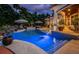 Inviting swimming pool with a spa and ample patio space at 118 Harbor View Ln, Belleair Bluffs, FL 33770